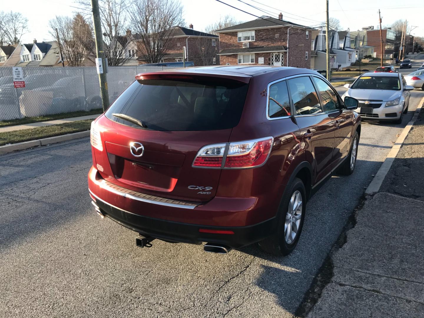 2012 Red /Tan Mazda CX-9 Touring (JM3TB3CV5C0) with an 3.7 V6 engine, Automatic transmission, located at 577 Chester Pike, Prospect Park, PA, 19076, (610) 237-1015, 39.886154, -75.302338 - Photo#4